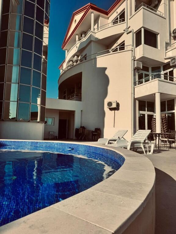 Outdoor swimming pool and sun terrace at Hotel Dabi Imperial